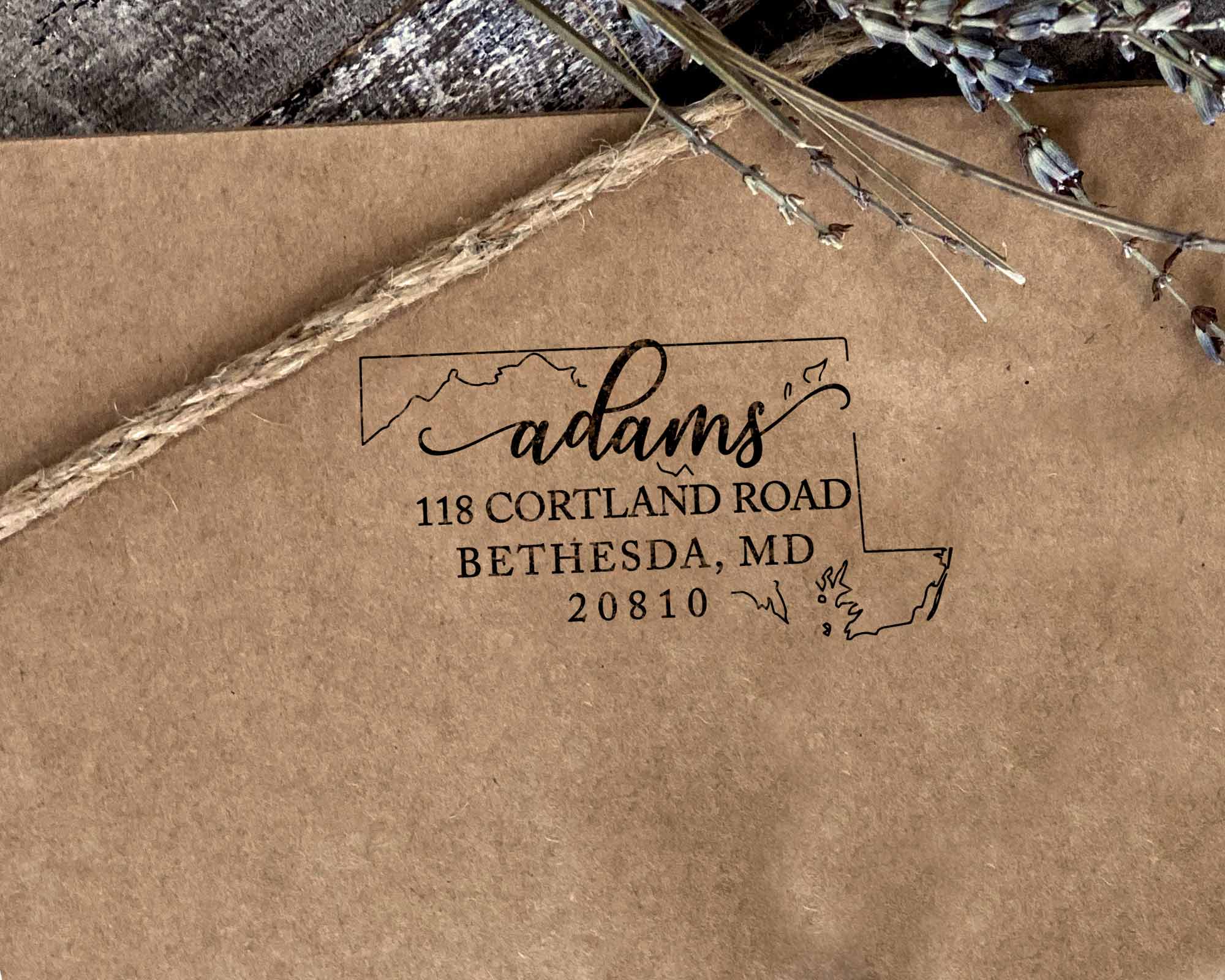Maryland state return address stamp customized for the Adams' family with a silhouette of the MD state