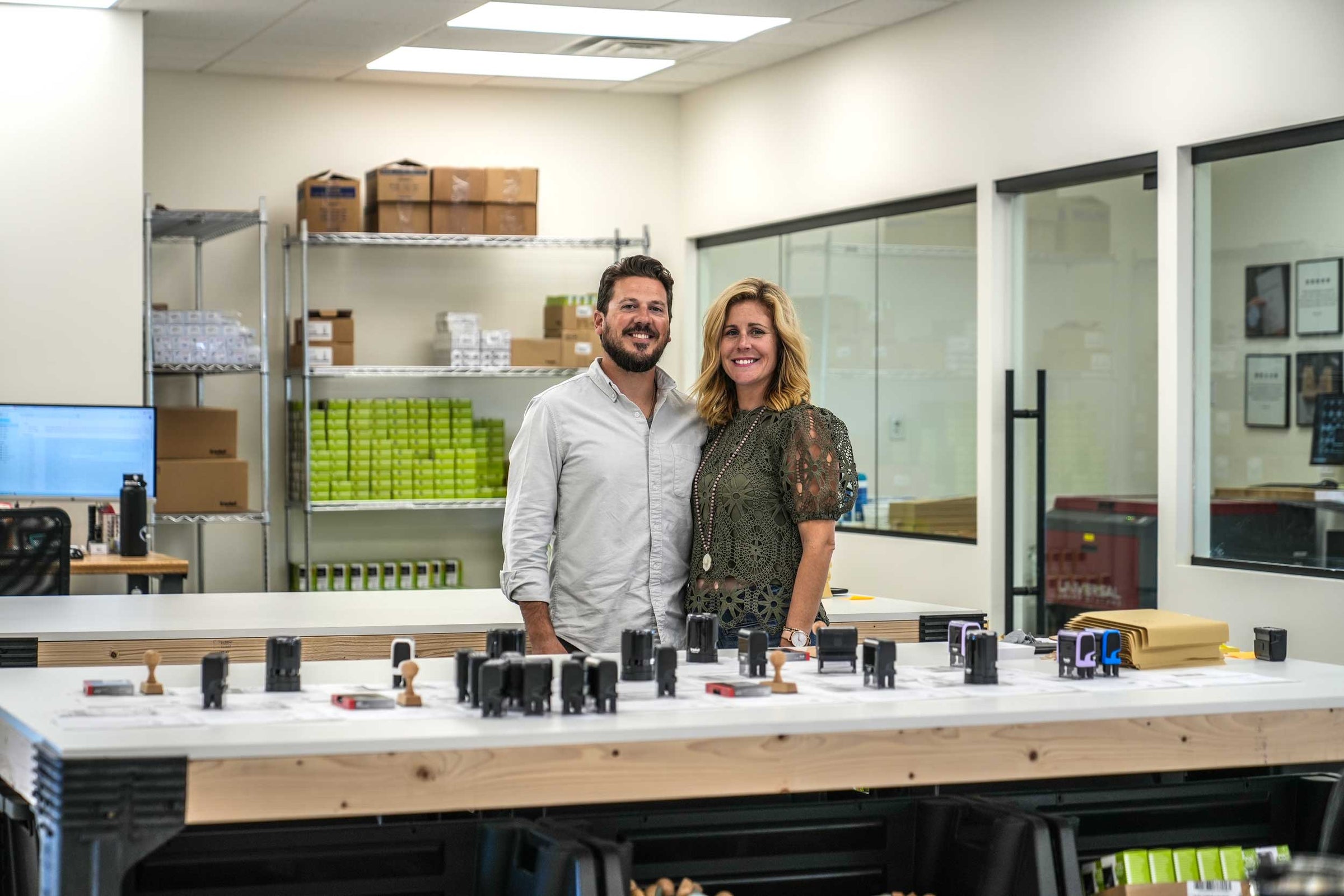 stamped with love founder Theresa and Ben in their custom stamp making studio