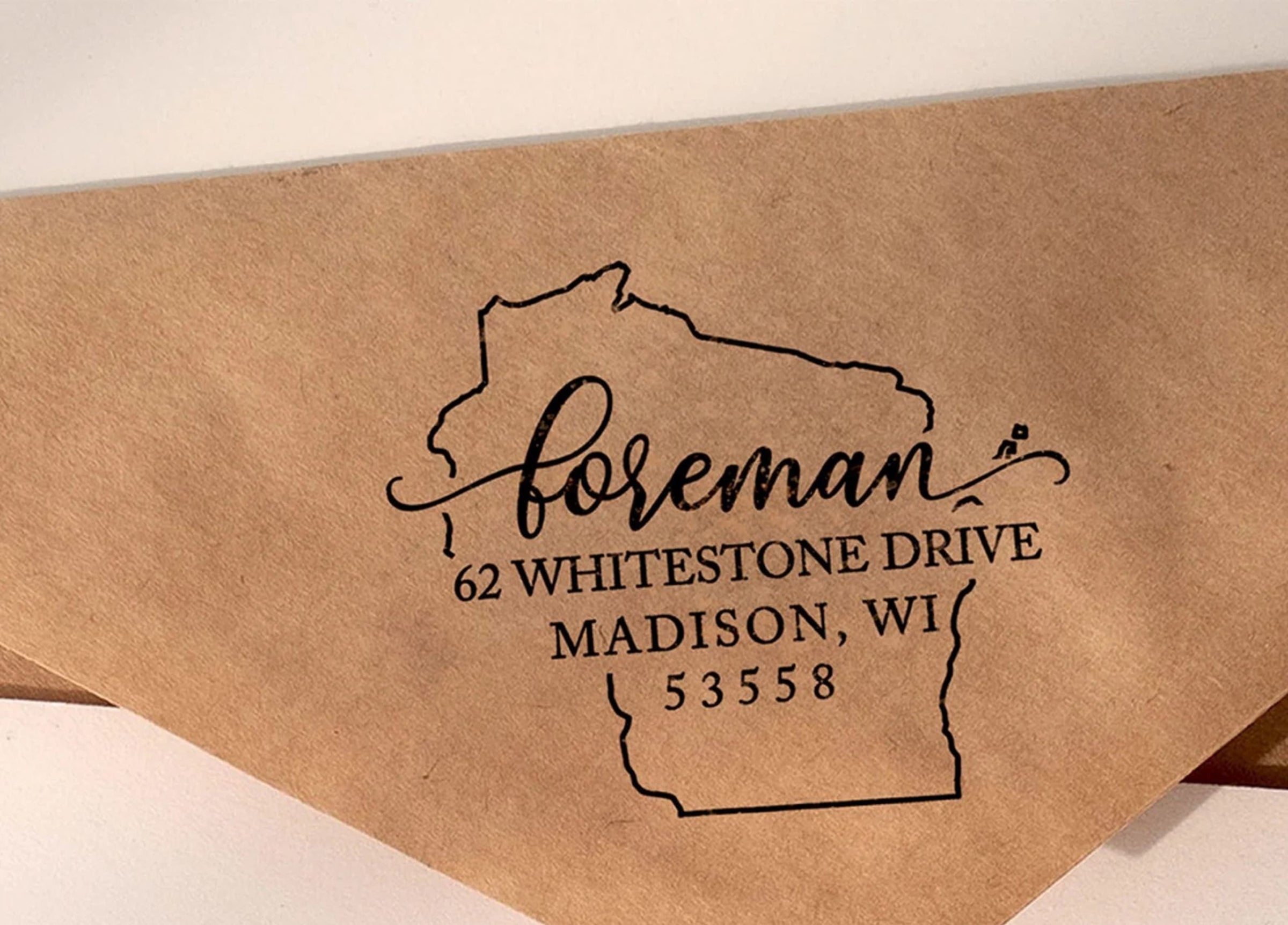 Custom Wisconsin state outline return address stamp in black for Foreman, Madison WI