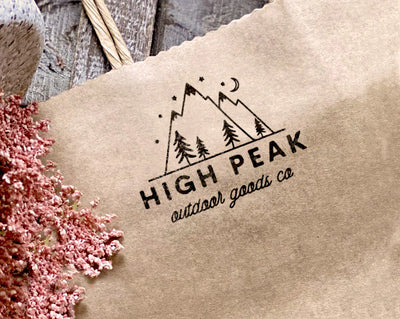 High Peak Outdoor Goods Company logo stamp imprinted on a brown paper bag