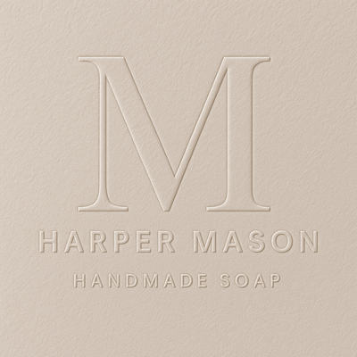 Embossed logo for wedding photographer Elizabeth Monroe in elegant circular design