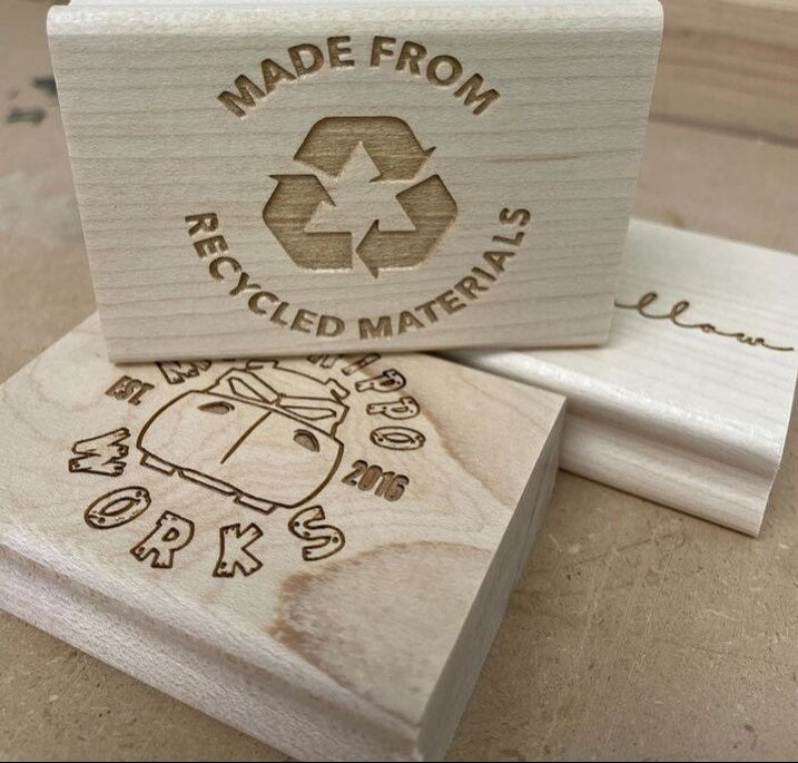 Eco-friendly engraved wooden stamps with recycled materials and custom designs