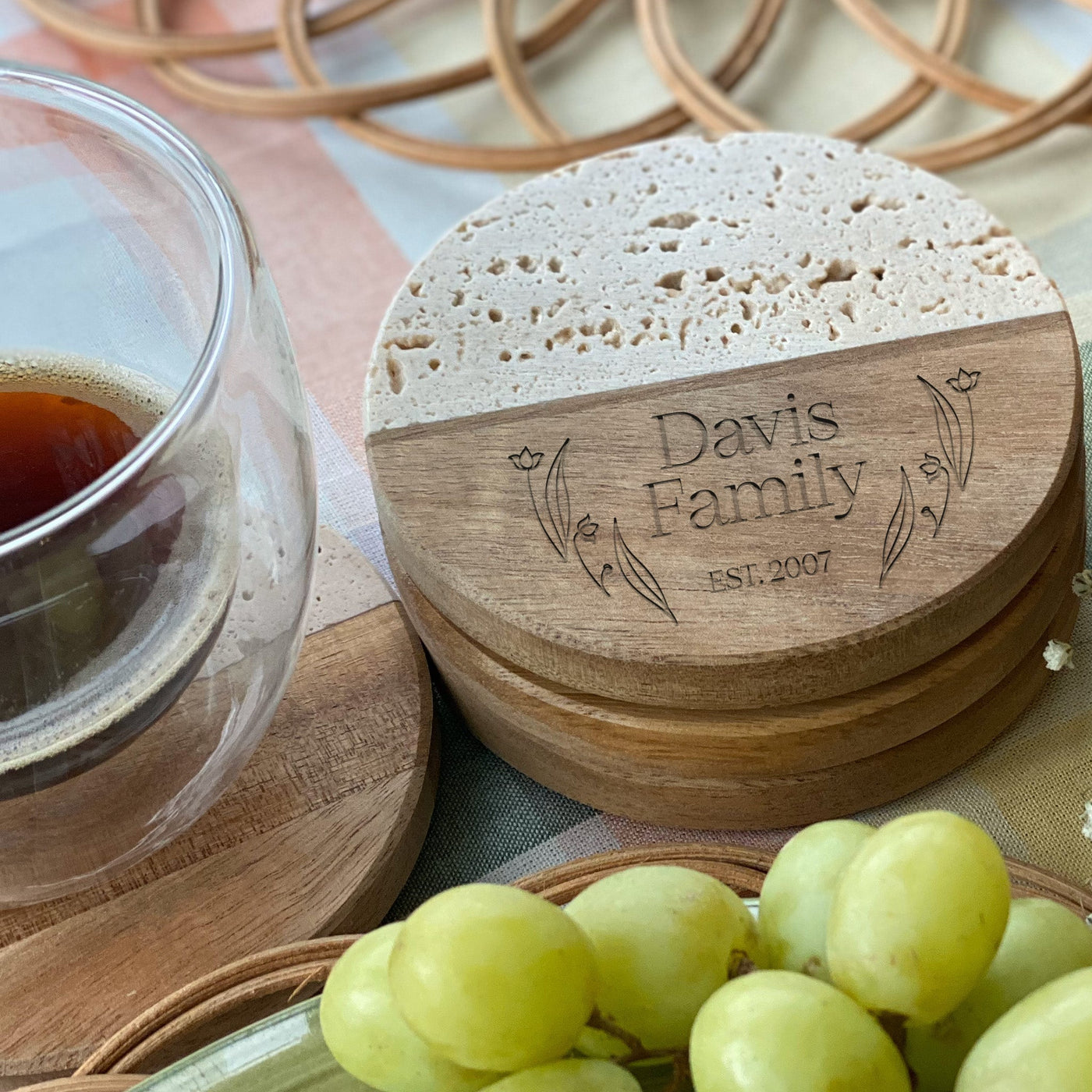 three round travertine style coasters laid on top of each other with wood engravings that say davis family est 2007