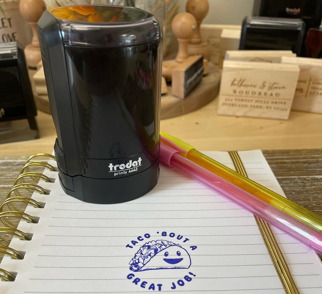 Fun teacher stamp with smiling taco and phrase taco ‘bout a great job in blue ink