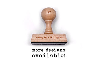 wood handle rubber stamp with stamped with love logo engraved on the base and heart symbol on the handle
