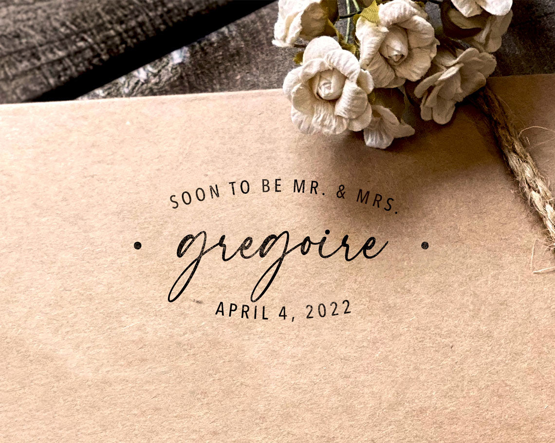 craft paper with elegant black ink stamp imprint reading Soon to be Mr & Mrs Gregoire with the date April 4 2022 below