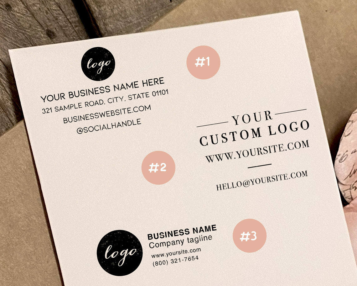 Three design mockups for custom rubber stamps on a business card featuring placeholders for a business name logo and contact information on a wooden surface